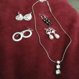Multiple pairs of earring and faux diamond necklac